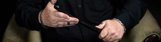 Daddy Dom with at leather paddle 